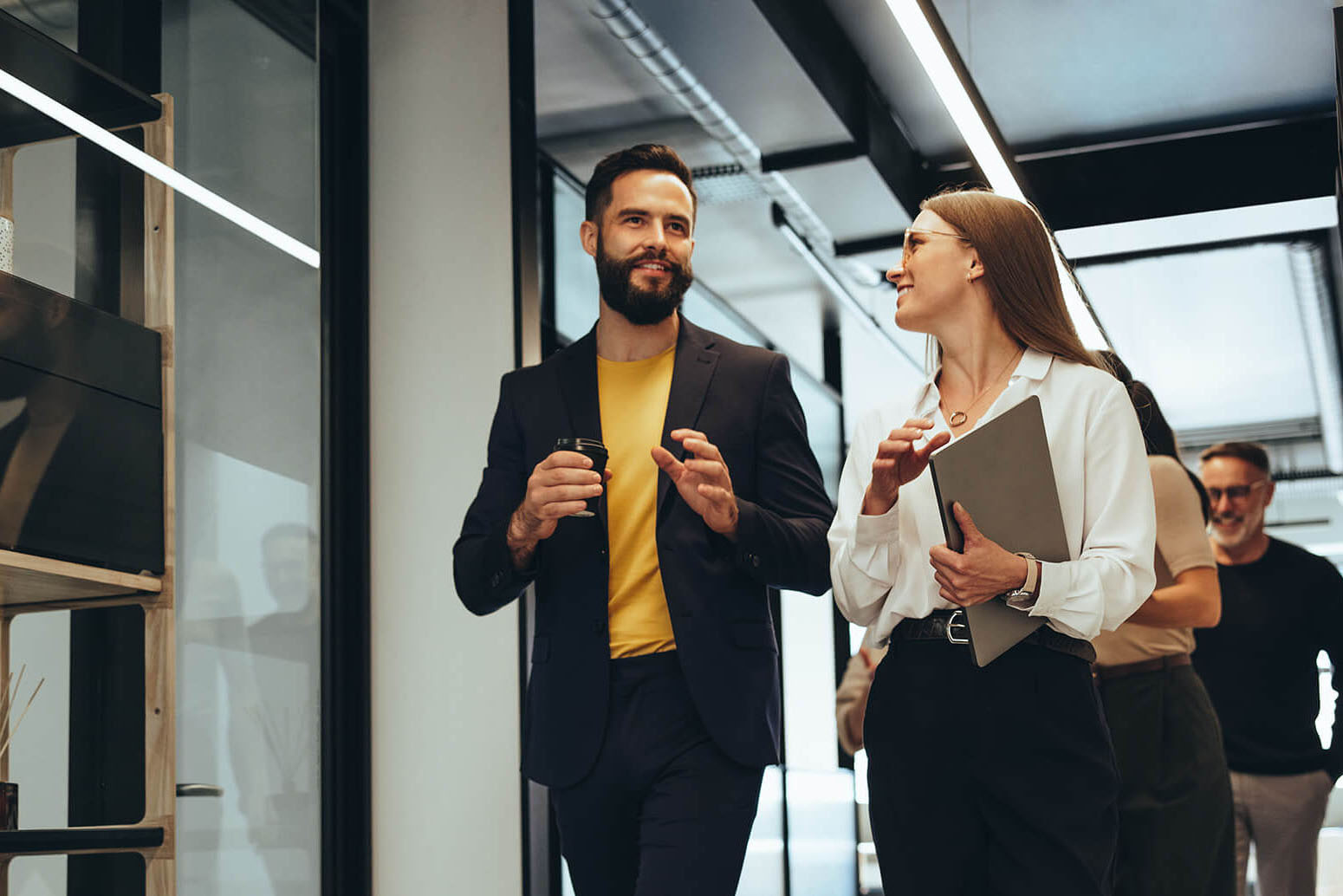 Business people walking together in an office